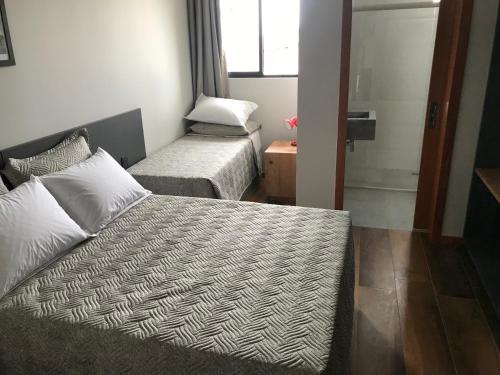 Postel nebo postele na pokoji v ubytování Hotel Blumenhof Balneário Camboriú