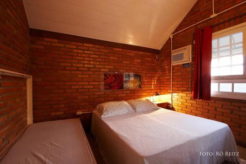 Postel nebo postele na pokoji v ubytování Pousada Casa de Praia