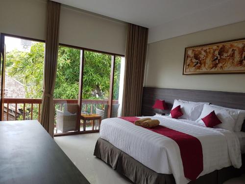 Ένα ή περισσότερα κρεβάτια σε δωμάτιο στο Puri Kesari Guest House