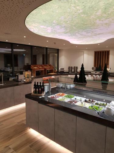a buffet line with food on display in a restaurant at Hotel Der Waldhof in Zell am See