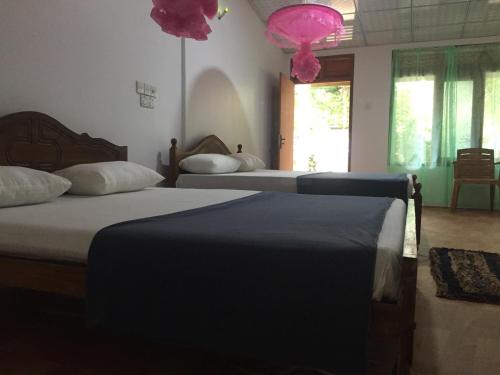 Postel nebo postele na pokoji v ubytování Margosa Guesthouse
