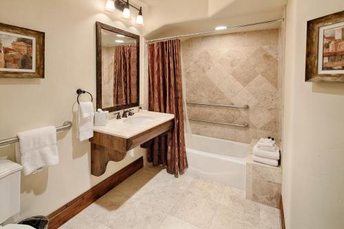 a bathroom with a sink and a bath tub at Silver Strike #702 - 1 Bed in Park City