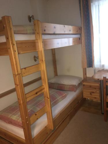 a couple of bunk beds in a room at Ciasa Gabriel in Colfosco
