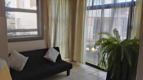 Χώρος καθιστικού στο Ezulwini Guest House