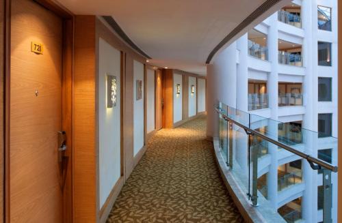 a corridor in a building with a hallwayiterator sidx sidx sidxktopktop at Radisson Blu Hotel New Delhi Dwarka in New Delhi