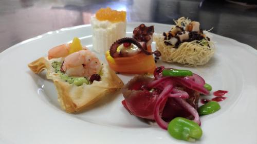 a white plate with different types of food on it at Masseria Stellato in Nardò