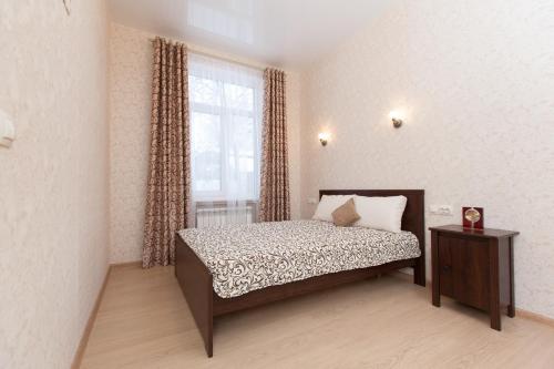 Кровать или кровати в номере Гостевой дом на Кызыл - армейской