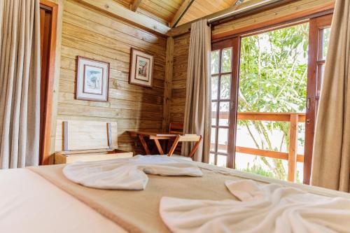 Postel nebo postele na pokoji v ubytování Pousada Homestay Jaraguá Do Sul