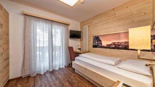 Кровать или кровати в номере Hotel Interski