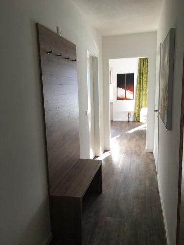 a living room with a large mirror on the wall at Appartements Marlene in Maishofen