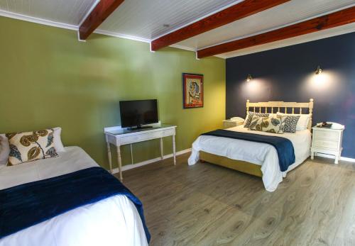 Letto o letti in una camera di Tsitsikamma Village Inn