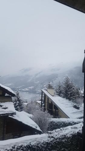 a snow covered roof of a house with snow on it at Hotel Martin in Sauze dʼOulx