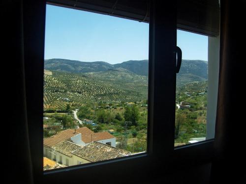 a view of a city from a window at Hotel Hospederia San Francisco in Priego de Córdoba