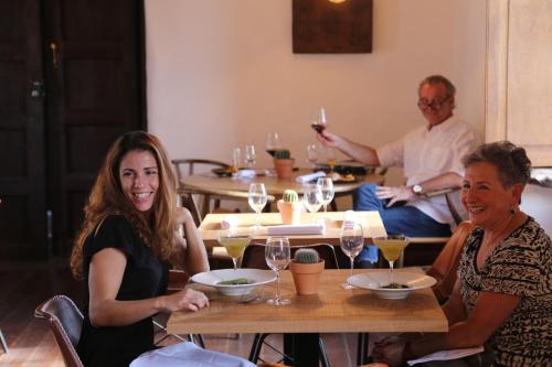 a group of people sitting at a table with wine glasses at Hotel Boutique Palacio Ico - Only Adults in Teguise
