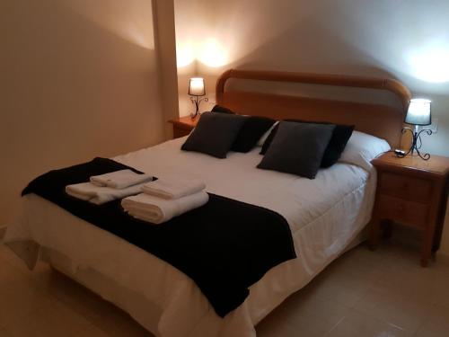 Postel nebo postele na pokoji v ubytování Acogedor Apartamento