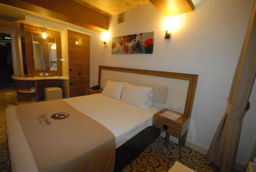 Ein Bett oder Betten in einem Zimmer der Unterkunft Hotel Izgi Turhan