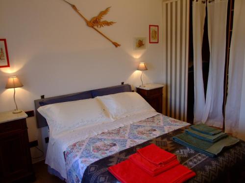a bedroom with a bed with towels on it at Podere La Vigna in Orvieto