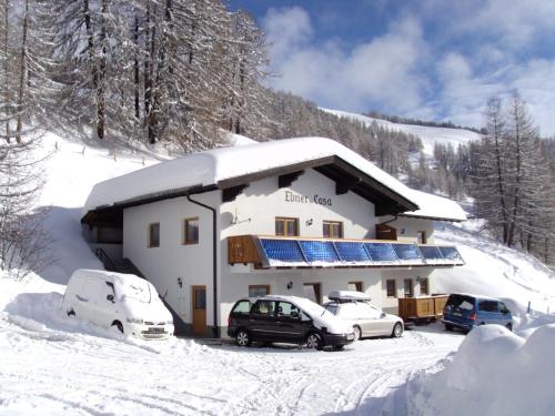 a building with solar panels on it in the snow at Ebner Casa in Heiligenblut