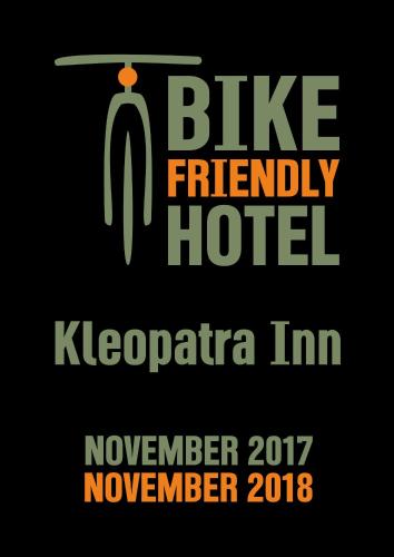 a sign that reads bike friendly hotel klezmereria imnoveccaim at Kleopatra Inn in Messini
