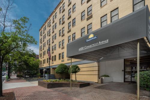 a building with a sign on the front of it at Days Inn by Wyndham Washington DC/Connecticut Avenue in Washington