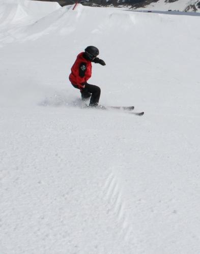 a person is skiing down a snow covered slope at Friendly House in Kolomyya