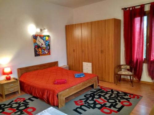 Ένα ή περισσότερα κρεβάτια σε δωμάτιο στο Appartamento La Chiocciola