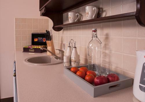 a kitchen counter with a drawer with apples and a sink at Ekaterinoslav in Dnipro