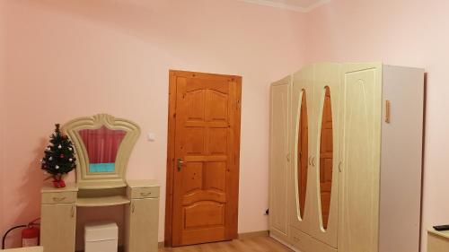 a room with a door and a table and a mirror at Lara in Solochin