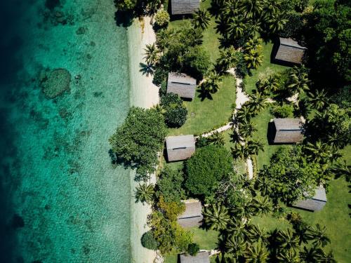an aerial view of a park next to the ocean at Aore Island Resort in Luganville