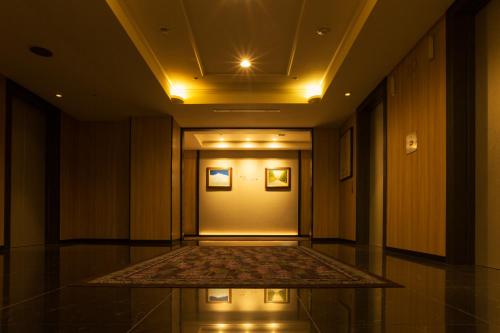 a hallway of a building with a hallwayngth at Sapporo Excel Hotel Tokyu in Sapporo