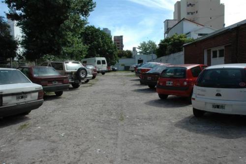 a bunch of cars parked in a parking lot at Palace Hotel in Miramar