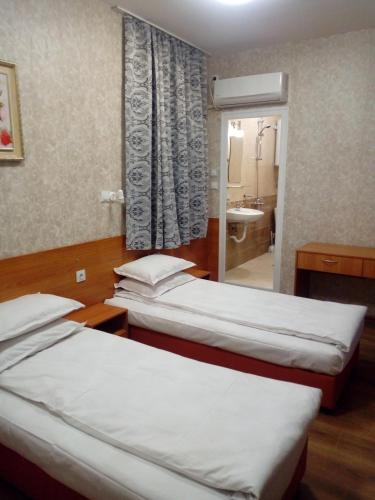 Ένα ή περισσότερα κρεβάτια σε δωμάτιο στο Hotel Toni