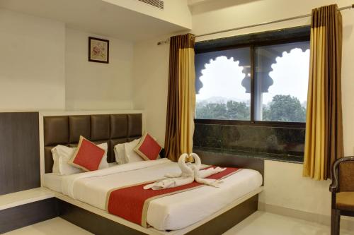Krevet ili kreveti u jedinici u objektu Hotel Riddhi Inn