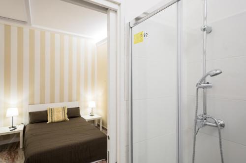Postel nebo postele na pokoji v ubytování Camere Pallotta
