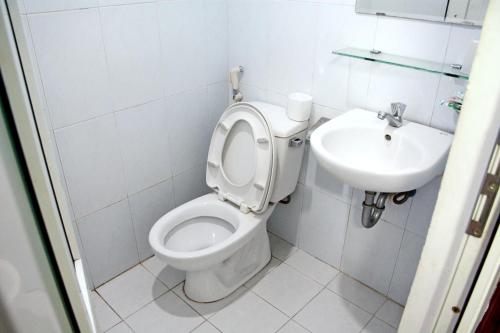 a bathroom with a toilet and a sink at Cat An Guesthouse in Hue