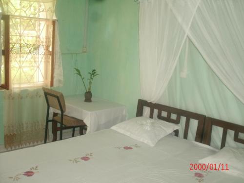 Un pat sau paturi într-o cameră la Hotel Le Sultan