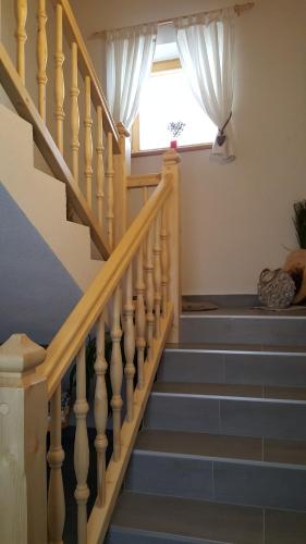 a staircase with blue steps and a window at Apartment Greidlerhof in Rohrberg