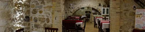 a dining room with tables and chairs in a building at Agriturismo Sorgente di Luna in Larino
