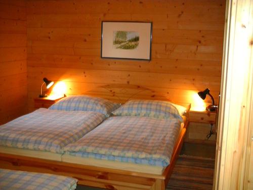 Ein Bett oder Betten in einem Zimmer der Unterkunft Appartements Zirbenalm