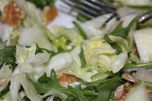 a plate of salad with a fork in it at Villa Ingrid in Borgholm