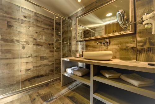 a bathroom with a sink and a shower at Congo Palace in Athens