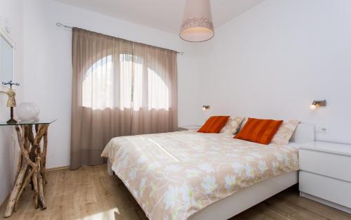 Postel nebo postele na pokoji v ubytování Apartments Matea I