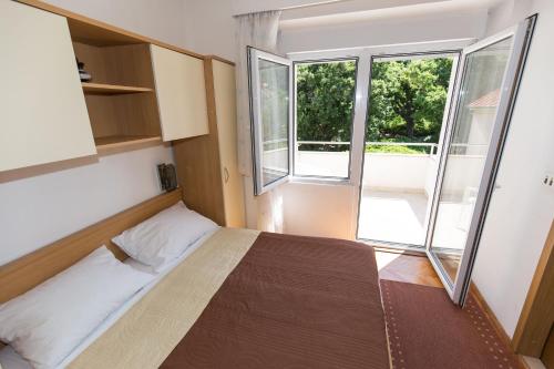 Postel nebo postele na pokoji v ubytování Apartment Davorka