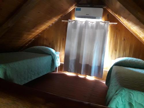 A bed or beds in a room at Cabañas SOLANAS