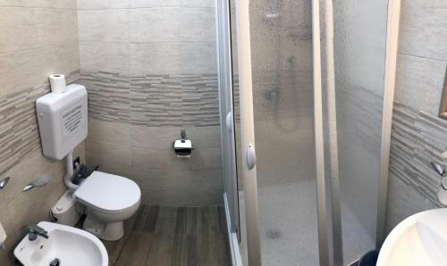 a bathroom with a shower and a toilet and a sink at B&B Pontepiccolo in Catanzaro