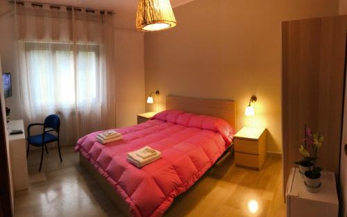 a bedroom with a large red bed in a room at B&B Pontepiccolo in Catanzaro