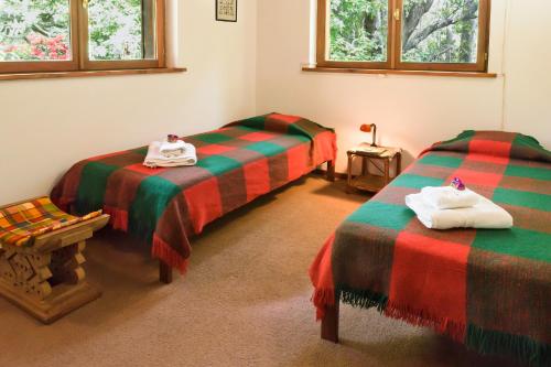 En eller flere senger på et rom på Casa Fischer del Lago