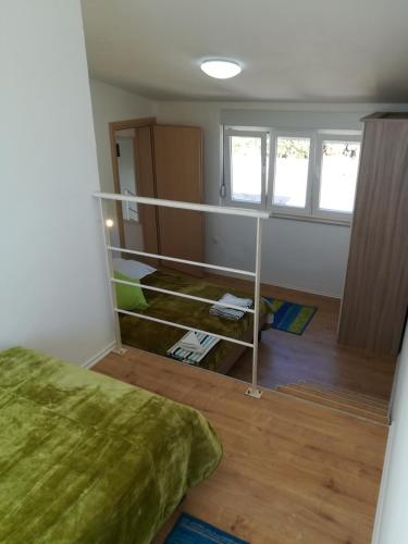 a room with a bed and a room with a shelf at Apartment Ana Marija Savar in Savar