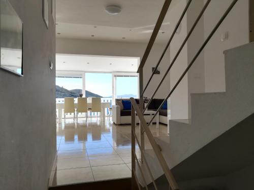 a living room with a couch and a table and chairs at Apartment Ana Marija Savar in Savar