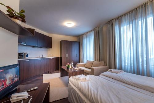 Ένα ή περισσότερα κρεβάτια σε δωμάτιο στο Aparthotel Aspen